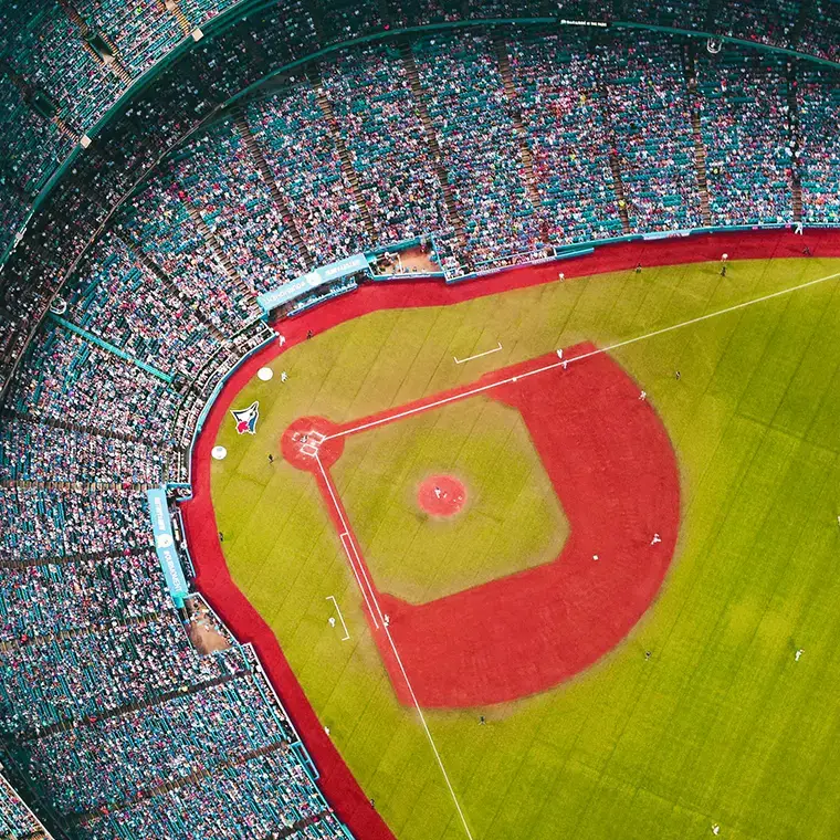 Aerial view of a packed baseball stadium during a live game