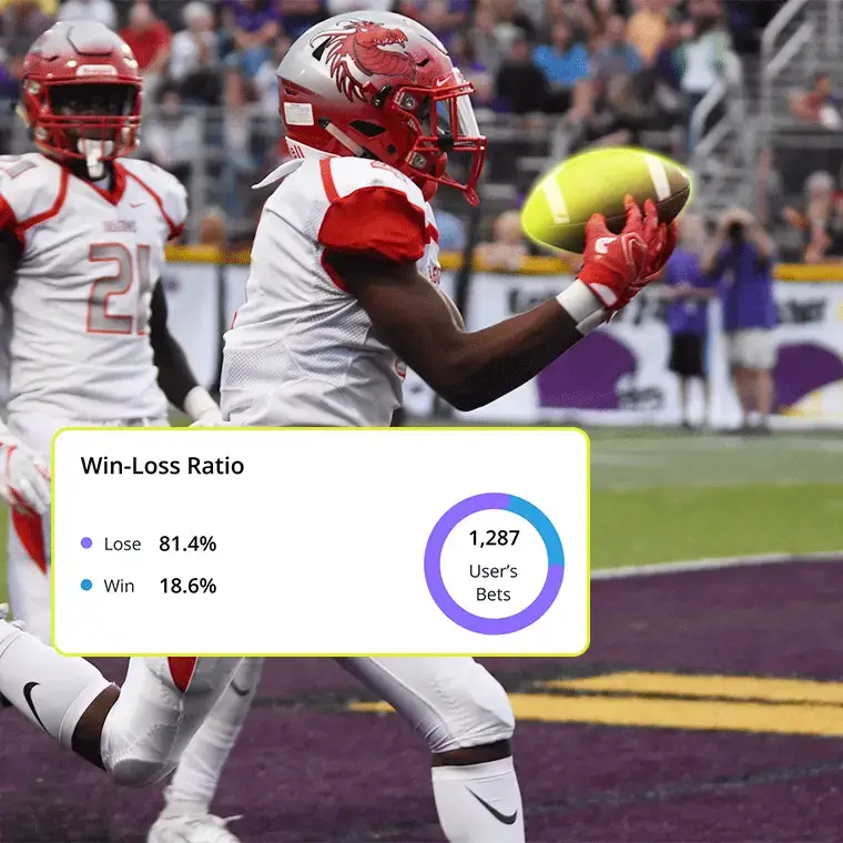 American football player catching a pass in the end zone with win-loss betting stats overlay